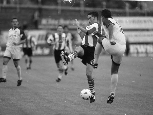 Gary Beckett and Marinko Šarkezi contest a fifty-fifty.