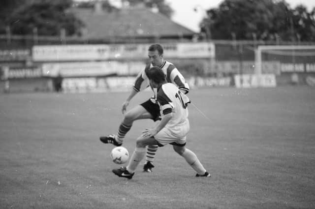 Liam Coyle takes on Alojz Fricelj.