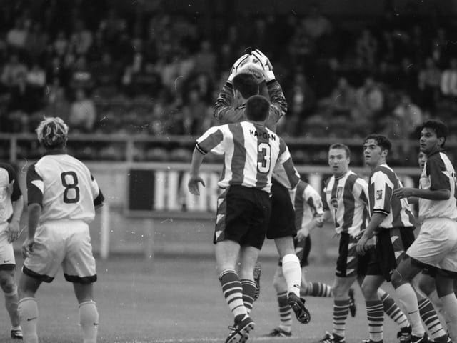 Marko Simeunovič gathers as Sean Hargan looks on.
