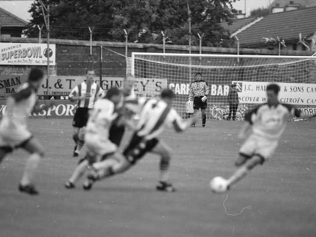 Declan Devine and Paul Curran watch the action from a distance.
