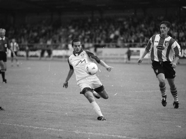Marinko Šarkezi comes away with the ball as Gary Beckett looks on.