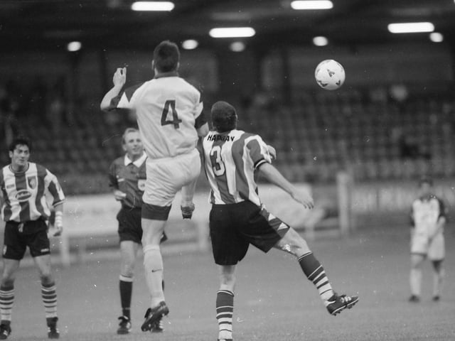 Sean Hargan and Spasoje Bulajič challenge in the air.