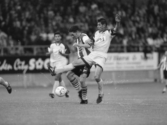 Gary Beckett comes away with the ball.