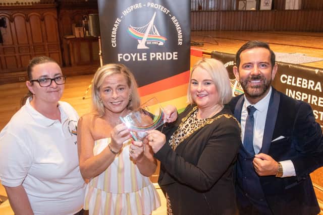 The Terry McCartney Award for Social Awareness at the Foyle Pride Awards 2022 was awarded to Derry Girls writer Lisa McGee and presented byTerry's sister Michelle Toland and accepted on her behalf by the Mayor Councillor Sandra Duffy. Included are  Kathleen Bradley, Chairperson and Michael Doherty, Compere. Picture Martin McKeown. 22.08.22
