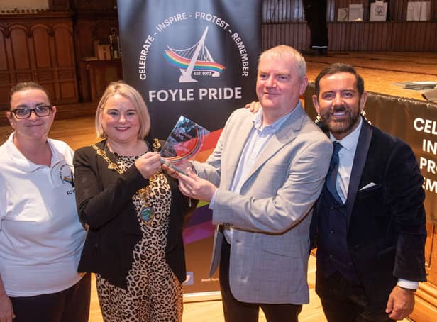 Derry City and Strabane District Council Mayor, Councillor Sandra Duffy presents the Mark Ashton Award for Outstanding Contribution to the LGBTQ+ Community to Martin McConnell-Logue during the Foyle Pride Awards in the Guildhall. Included are Kathleen Bradley, Chair of Foyle Pride and Michael Doherty who compered the event. Picture Martin McKeown. 22.08.22