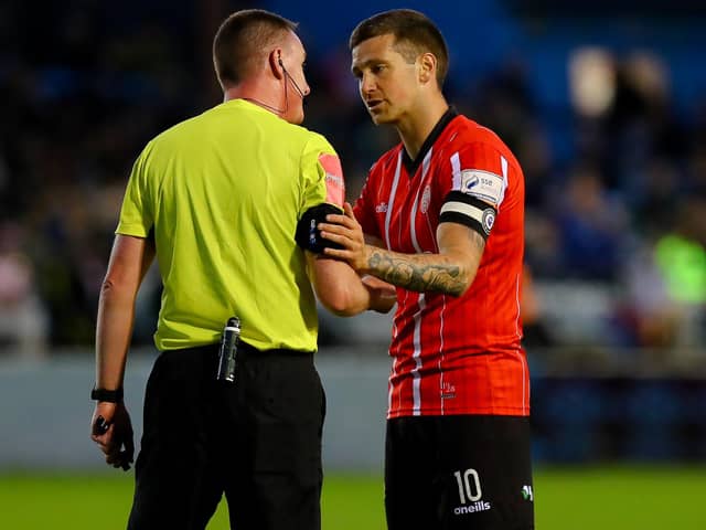 Derry City captain Patrick McEleney has a word with referee Damien MacGraith, during Friday night's game at Drogheda United.