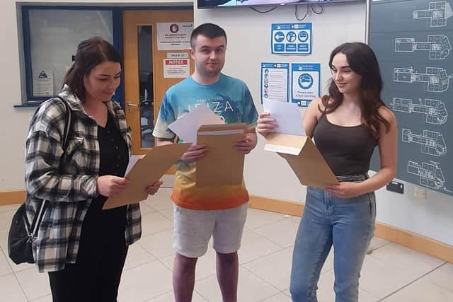 Amanda Courtney, Mark Doherty and Amy Hutcheon on results day.