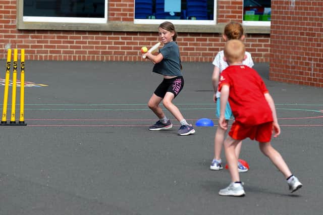 Young cricketer demonstrates her skill at the Eglinton Community Summer Scheme.