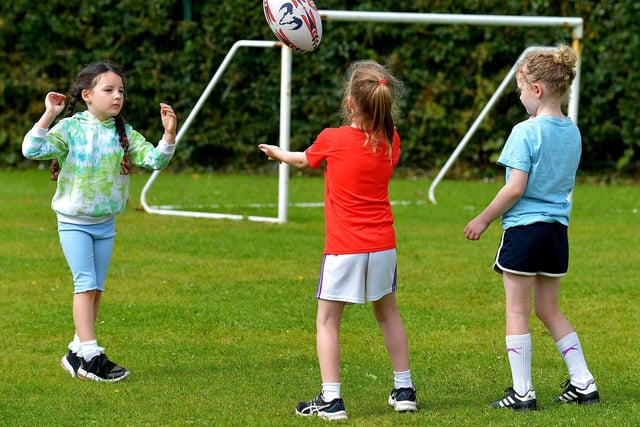Children get some rugby practice at the Eglinton Community Summer Scheme.