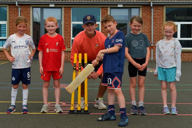 Cricket coach Don McDaid with some of the children who attended the Eglinton Community Summer Scheme.