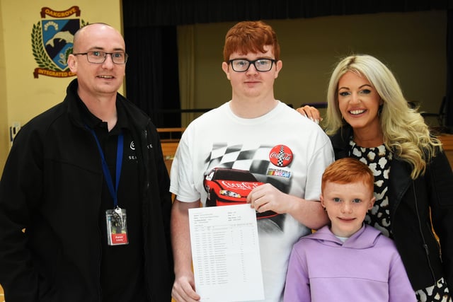WELL DONE BRADLEY!. . . . .Oakgrove Integrated College GCSE student Bradley Keenan-Doherty pictured with his parents Aaron and Michelle and his brother Mason on Thursday.