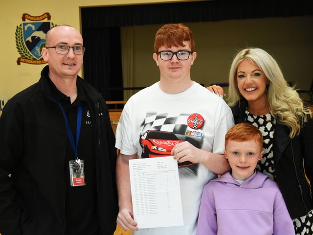 WELL DONE BRADLEY!. . . . .Oakgrove Integrated College GCSE student Bradley Keenan-Doherty pictured with his parents Aaron and Michelle and his brother Mason on Thursday.