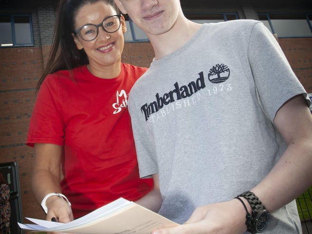 Adrian McDermott pictured with his mum checking over his GCSE results on Thursday morning at St. Columbâ€TMs College.
