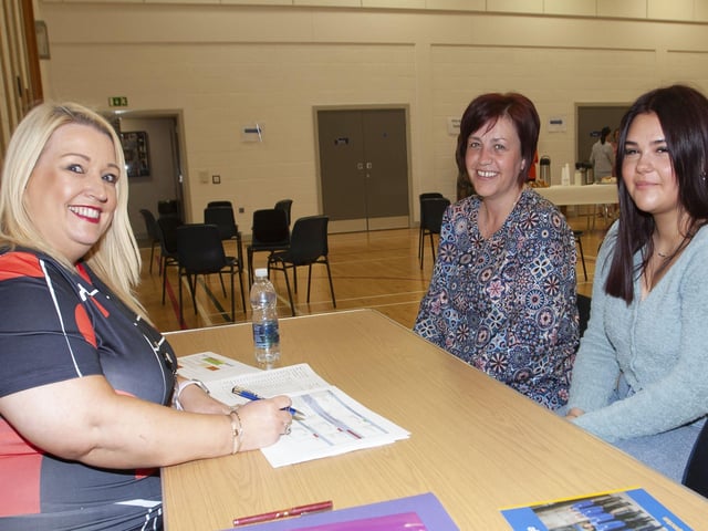 Ms. Roisin Rice, Vice Principal, discussing options with GCSE student Fay Norris and her mum Dorothy at St. Maryâ€TMs on Thursday.
