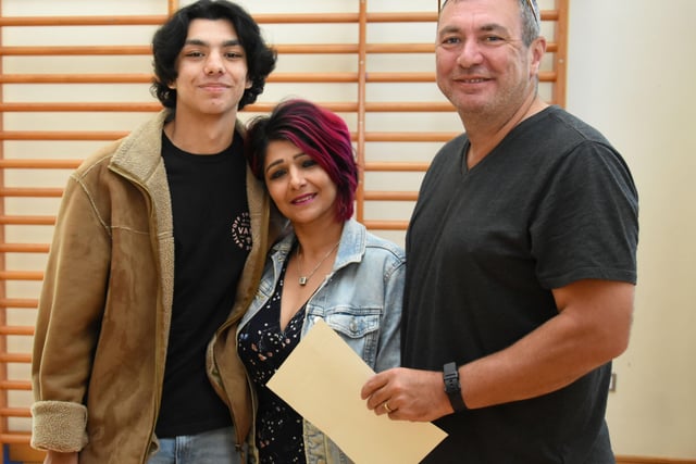 GCSE student Lukas Lynch pictured with his parents Sangita and James at Oakgrove Integrated College on Thursday morning.