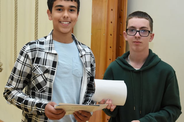 Omar Musa and Leo Arbuckle pick up their GCSE results at Oakgrove Integrated College on Thursday morning.