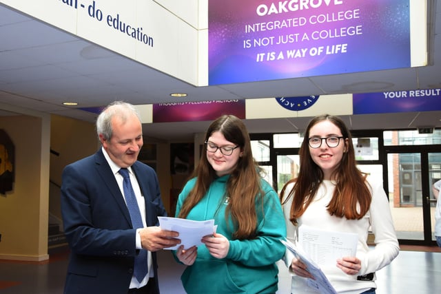 Oakgrove Integrated College Acting Principal, Mr John Harkin with GCSE students Amber Sweeney and Jamie-Leigh Parkhill.