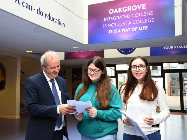 Oakgrove Integrated College Acting Principal, Mr John Harkin with GCSE students Amber Sweeney and Jamie-Leigh Parkhill.