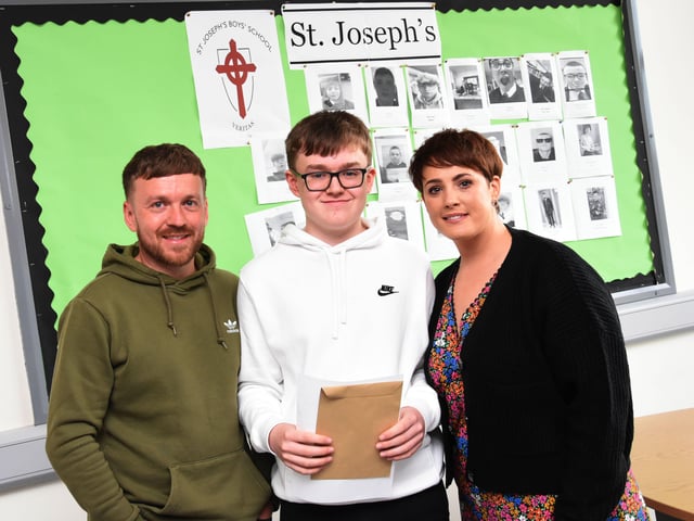 PROUD PARENTS. . . . . Tiernan McElhinney with proud parents Conall and Sarah after getting his results at St. Josephâ€TMs Boys School on Thursday morning.