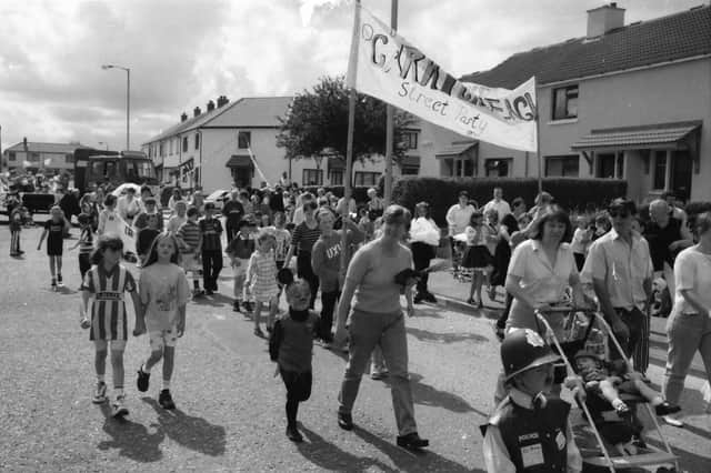 Residents of Carrickreagh take part in the Creggan festival parade during the estate’s 50th anniversary year.