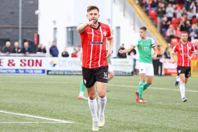 Derry City's Will Patching celebrates scoring from the penalty spot against Cork City.
