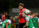 Derry City's Cameron McJannet heads away from Cork City's Kevin O'Connor.