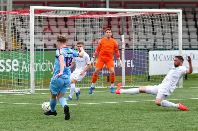 Institute's Matthew Walker fires home past Ballinamallard United goalkeeper Michael Lynch.