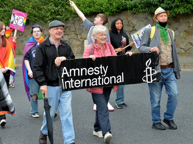 Local Amnesty International members at the Foyle Pride Parade in Derry on Saturday afternoon. Photograph: George Sweeney / Derry Journal. DER2234GS – 035