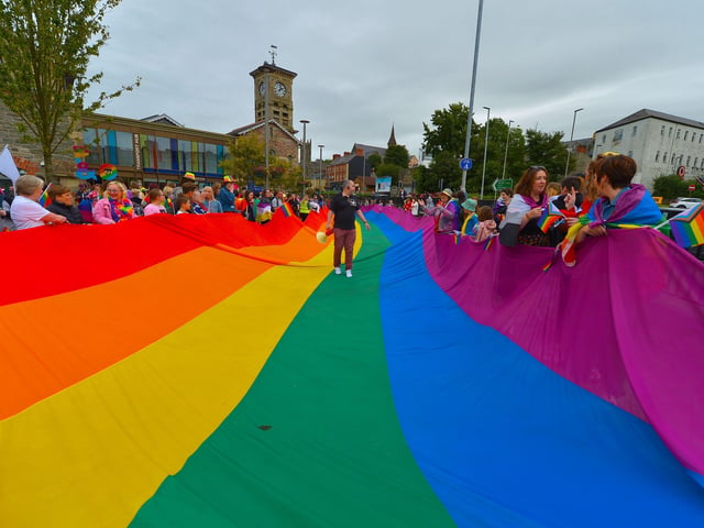 Preparing the rainbow flag for the Foyle Pride Parade in Derry on Saturday afternoon. Photograph: George Sweeney / Derry Journal. DER2234GS – 025