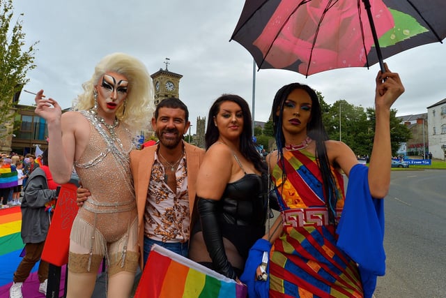 Mickey Doherty enjoys the atmosphere of the Foyle Pride Parade with participants on Saturday afternoon. Photograph: George Sweeney / Derry Journal. DER2234GS – 021