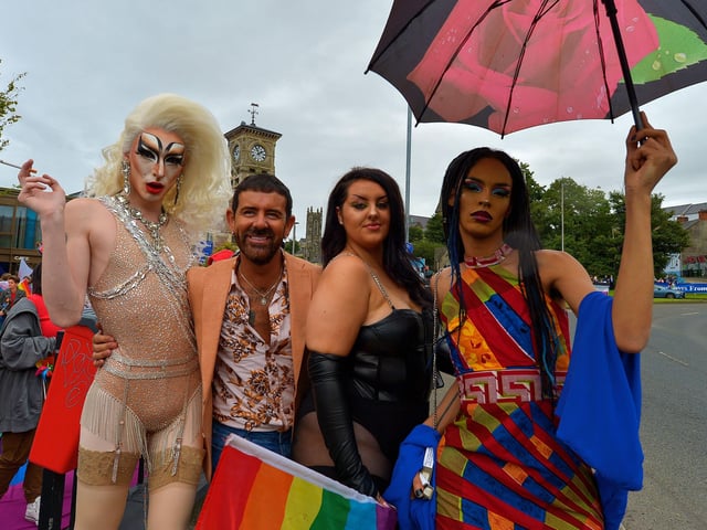 Mickey Doherty enjoys the atmosphere of the Foyle Pride Parade with participants on Saturday afternoon. Photograph: George Sweeney / Derry Journal. DER2234GS – 021