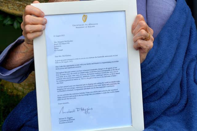 Peggy McGlinchey, who celebrated her 100th birthday at the Beach Hill Manor Private Nursing Home at Lisfannon on Friday, pictured with a letter of congratulations from President Michael D. Higgins. Photo: George Sweeney.  DER2234GS – 004