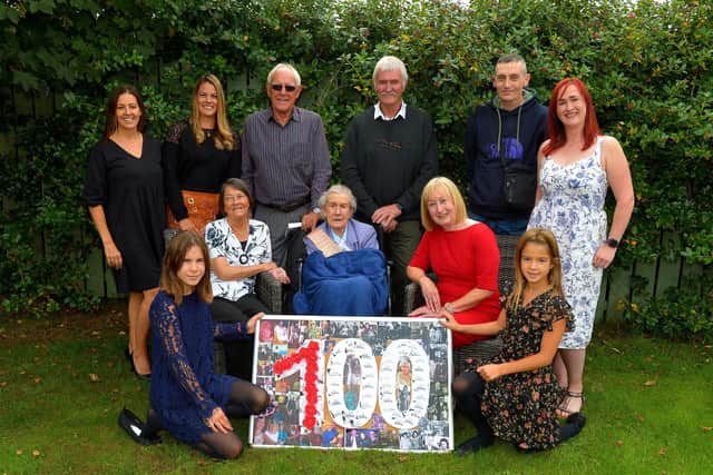 Peggy McGlinchey celebrated her 100th birthday at the Beach Hill Manor Private Nursing Home at Lisfannon on Friday last with her extended family. Back row, from left, Amy Churchyard, Emily Watts, Raymond Churchyard, George Burton, Steve Chatten and Lisa Burton. Front row from left, Nuala Doyle, Rita Churchyard, Peggy McGlinchey , Sue Burton and Ivy Doyle.   Photo: George Sweeney.  DER2234GS – 002
