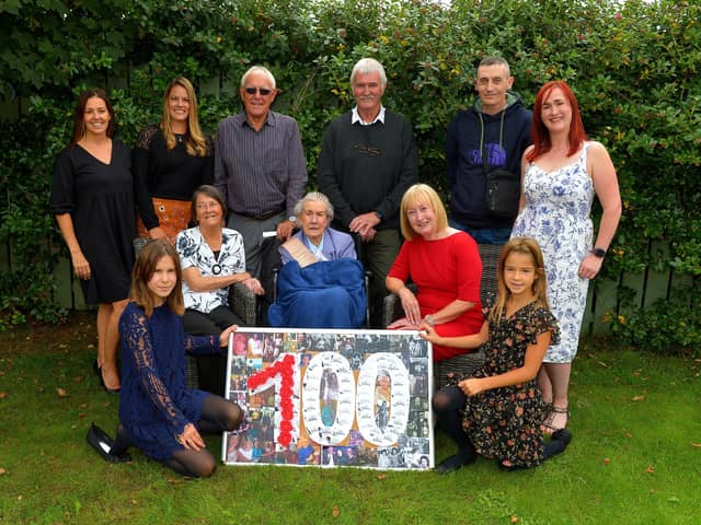 Peggy McGlinchey celebrated her 100th birthday at the Beach Hill Manor Private Nursing Home at Lisfannon on Friday last with her extended family. Back row, from left, Amy Churchyard, Emily Watts, Raymond Churchyard, George Burton, Steve Chatten and Lisa Burton. Front row from left, Nuala Doyle, Rita Churchyard, Peggy McGlinchey , Sue Burton and Ivy Doyle.   Photo: George Sweeney.  DER2234GS – 002