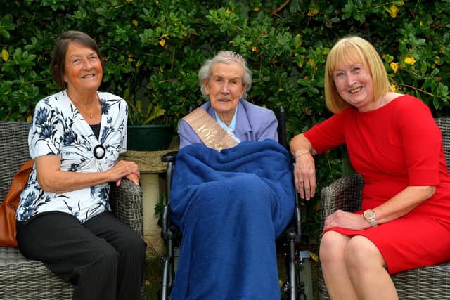 Peggy McGlinchey, who celebrated her 100th birthday at the Beach Hill Manor Private Nursing Home at Lisfannon on Friday last pictured with her daughters Rita Churchyard and Sue Burton. Photo: George Sweeney.  DER2234GS – 001