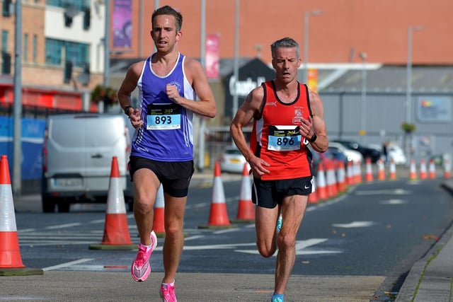 Third placed Scott Rankin, Foyle Valley, City of Derry Spartans’ Declan Reed, who finished second, make their way along the Foyle Embankment. Photo: George Sweeney.  DER2236GS – 019