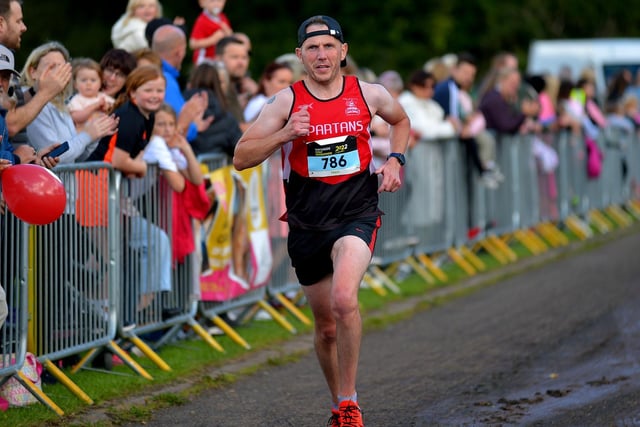 City of Derry Spartan Mark Mullan finishes the 39th Waterside Half Marathon on Sunday morning last. Photo: George Sweeney.  DER2236GS – 022