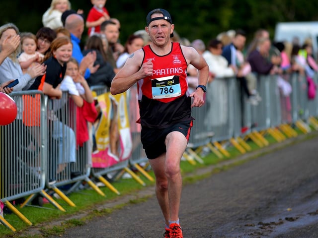 City of Derry Spartan Mark Mullan finishes the 39th Waterside Half Marathon on Sunday morning last. Photo: George Sweeney. DER2236GS – 022