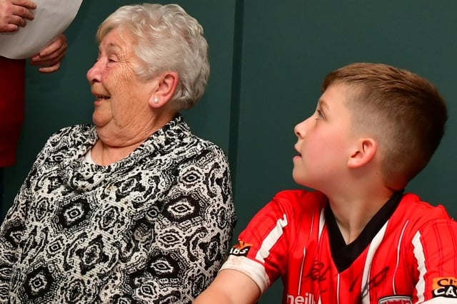 Bridie McCormick, Edgar's wife alongside grandson Jamie, enjoying themselves at the prize giving, which took place at Foyle Golf Centre, on Saturday.
