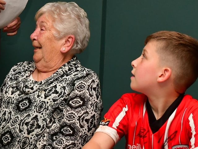 Bridie McCormick, Edgar's wife alongside grandson Jamie, enjoying themselves at the prize giving, which took place at Foyle Golf Centre, on Saturday.