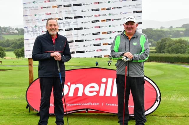 Jim Nicell and Sean Barrett getting ready to tee off at the first hole at the Edgar McCormick Golf Classic.