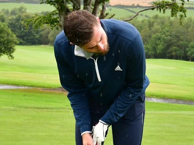 Will Patching lining up a putt during Saturday's Edgar McCormick Golf Classic, which took place at Foyle Golf Centre.