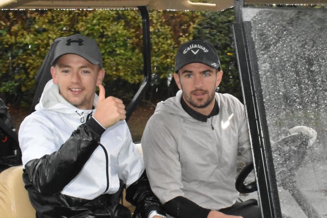 Thumbs up from Derry City's Ciaron Harkin and team-mate Michael Duffy. who drove the pair around in the golf buggy, during Saturday's Edgar McCormick Golf Classic, at Foyle Golf Centre.