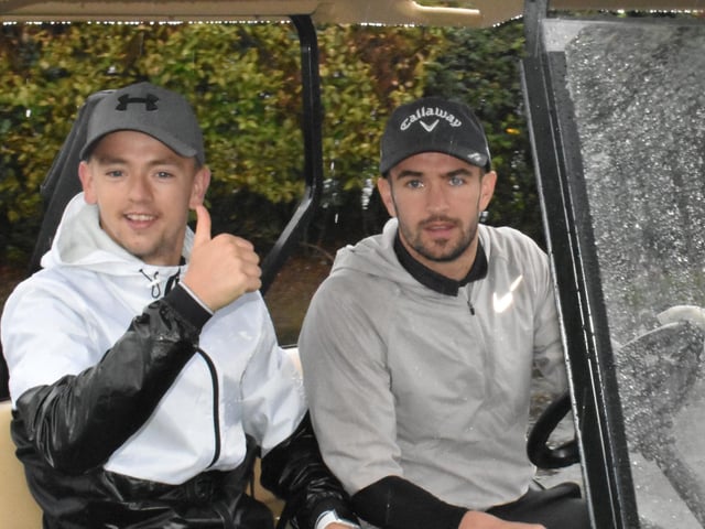 Thumbs up from Derry City's Ciaron Harkin and team-mate Michael Duffy. who drove the pair around in the golf buggy, during Saturday's Edgar McCormick Golf Classic, at Foyle Golf Centre.