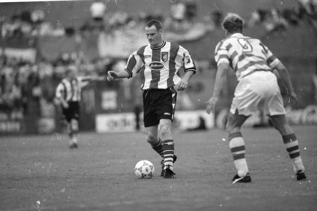 Derry's Paul Hegarty is watched closely by Celtic's Morten Wieghorst.