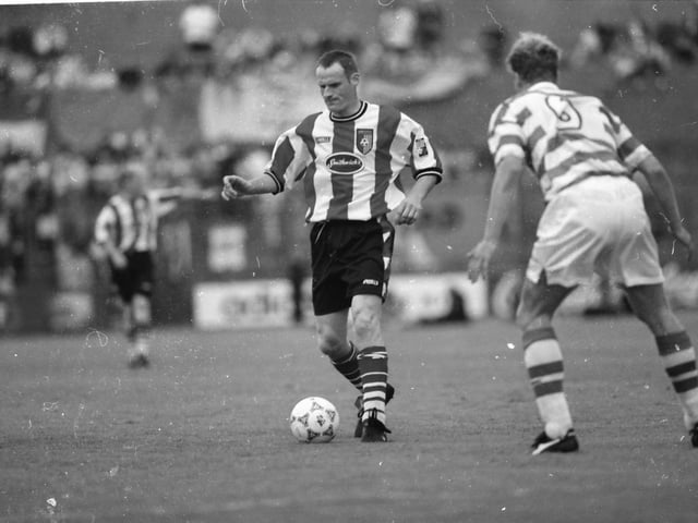 Derry's Paul Hegarty is watched closely by Celtic's Morten Wieghorst.