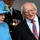 Queen Elizabeth II stands with Irish President Michael D. Higgins. Photo credit: BEN STANSALL/AFP via Getty Images