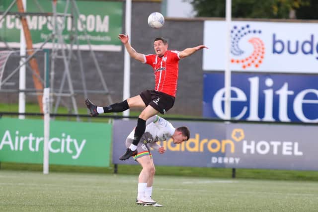Derry City defender Ciaran Coll falls heavily to the ground under the challenge of Bohemians' Ali Coote last Friday night.