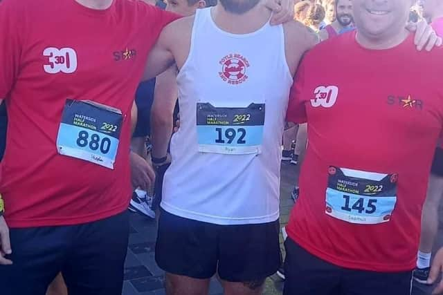 Ryan Dillon (centre) with Stephen Quigley and Seamus Crossan who are doing 30 half marathons in 30 days in September.