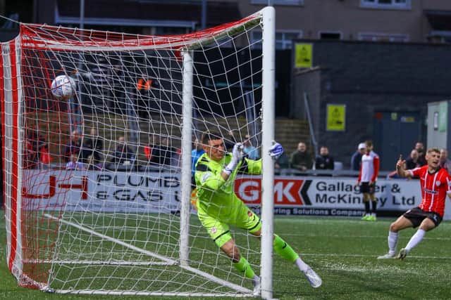 Sligo Rovers keeper Luke McNicholas ends up in the back of the net with the ball after Will Patching opened the deadlock with a sublime free-kick.